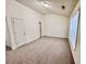 Spacious carpeted bedroom with two closets, a window with blinds, and neutral walls at 4842 Hairston Park Sq, Stone Mountain, GA 30083