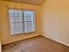 This bedroom features carpet floors, neutral paint, and double-paned windows to let the sunshine in at 4842 Hairston Park Sq, Stone Mountain, GA 30083
