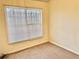 Neutral bedroom featuring cozy carpet, one window with blinds, and base trim at 4842 Hairston Park Sq, Stone Mountain, GA 30083