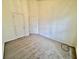 This bedroom features carpet floors, neutral paint, and two doors to closets or other rooms at 4842 Hairston Park Sq, Stone Mountain, GA 30083