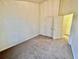This bedroom features carpet floors, neutral paint, and two doors to closets or other rooms at 4842 Hairston Park Sq, Stone Mountain, GA 30083