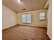 This bedroom features carpet floors, neutral paint, and double-paned windows to let the sunshine in at 4842 Hairston Park Sq, Stone Mountain, GA 30083
