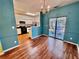 Cozy dining space with hardwood floors adjacent to the kitchen area at 4842 Hairston Park Sq, Stone Mountain, GA 30083