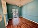 Charming dining area featuring hardwood floors and a stylish chandelier fixture at 4842 Hairston Park Sq, Stone Mountain, GA 30083