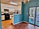 Open dining area next to kitchen offering bright natural light and hardwood floors at 4842 Hairston Park Sq, Stone Mountain, GA 30083