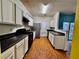 Well-lit kitchen featuring an abundance of cabinets and black appliances and countertops at 4842 Hairston Park Sq, Stone Mountain, GA 30083