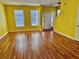 Spacious living room with hardwood floors, large windows, and ample natural light at 4842 Hairston Park Sq, Stone Mountain, GA 30083