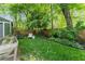 Lush backyard featuring a garden bed and chair, providing a peaceful outdoor space for relaxation at 541 Greenwood Ne Ave, Atlanta, GA 30308