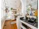 Charming bar area with glass shelves, granite countertop, and a view into the adjacent kitchen at 541 Greenwood Ne Ave, Atlanta, GA 30308