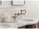 Close-up of dual vanities with marble countertops and designer fixtures in the primary bath at 541 Greenwood Ne Ave, Atlanta, GA 30308