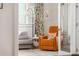 Well-lit Bedroom with comfortable seating, including a rocking chair at 541 Greenwood Ne Ave, Atlanta, GA 30308
