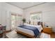 Primary bedroom showcasing hardwood floors, a walkout to the deck, and plenty of natural light at 541 Greenwood Ne Ave, Atlanta, GA 30308