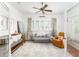 Bedroom with hardwood floors, a crib, and a futon at 541 Greenwood Ne Ave, Atlanta, GA 30308