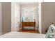 Bright bedroom boasts hardwood floors, neutral walls and a wooden dresser with ample sunlight at 541 Greenwood Ne Ave, Atlanta, GA 30308