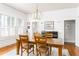 Dining room featuring a wooden table and chairs, and black piano in a naturally lit space at 541 Greenwood Ne Ave, Atlanta, GA 30308