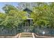 Charming two-story home with a fenced yard and mature trees offering privacy and curb appeal at 541 Greenwood Ne Ave, Atlanta, GA 30308