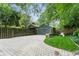 The garage has a paved driveway, green doors, and a custom accent window for added architectural interest at 541 Greenwood Ne Ave, Atlanta, GA 30308