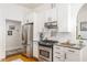 Modern kitchen features stainless steel appliances, white cabinets, and granite countertops at 541 Greenwood Ne Ave, Atlanta, GA 30308