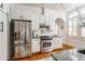 Kitchen with stainless steel appliances, white cabinetry, and hardwood floors at 541 Greenwood Ne Ave, Atlanta, GA 30308