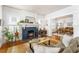 Bright living room featuring a charming fireplace and an open layout leading to the dining area at 541 Greenwood Ne Ave, Atlanta, GA 30308