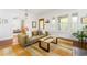 Comfortable living room with hardwood floors, a colorful rug, and a large sofa at 541 Greenwood Ne Ave, Atlanta, GA 30308