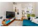 Cozy living room open to a modern kitchen, featuring stylish furniture and a mounted television at 541 Greenwood Ne Ave, Atlanta, GA 30308