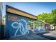 Modern restaurant exterior with a colorful mural, large windows, and outdoor seating, offering a trendy dining experience at 541 Greenwood Ne Ave, Atlanta, GA 30308