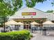 Restaurant with outdoor seating, with string lights and awnings, perfect for enjoying casual dining experiences at 541 Greenwood Ne Ave, Atlanta, GA 30308