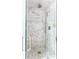 Modern shower with marble tile, rainfall showerhead, and frameless glass enclosure at 541 Greenwood Ne Ave, Atlanta, GA 30308