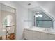 Bright bathroom with double sinks, a shower with glass door, and white cabinets at 675 W Paces Ferry Nw Rd # 11, Atlanta, GA 30327