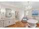 Upscale bathroom featuring a vanity, freestanding tub, and tasteful decor at 675 W Paces Ferry Nw Rd # 11, Atlanta, GA 30327