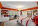 Bright bedroom with built-in shelving and desk, window views, and colorful accent wall at 675 W Paces Ferry Nw Rd # 11, Atlanta, GA 30327