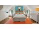 Bedroom featuring a bright accent wall, hardwood floors and coordinating decor at 675 W Paces Ferry Nw Rd # 11, Atlanta, GA 30327