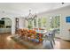 Elegant dining room features hardwood floors, large windows, and a decorative chandelier at 675 W Paces Ferry Nw Rd # 11, Atlanta, GA 30327