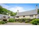 Beautiful home with stone driveway and lush garden, creating a private retreat at 675 W Paces Ferry Nw Rd # 11, Atlanta, GA 30327