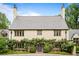 Charming home features a lovely garden surrounding the arched, purple front door at 675 W Paces Ferry Nw Rd # 11, Atlanta, GA 30327