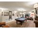 Game room featuring a pool table, brick floors, custom sconces, and unique decor at 675 W Paces Ferry Nw Rd # 11, Atlanta, GA 30327