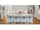 Spacious white kitchen features a large marble island with seating and modern appliances at 675 W Paces Ferry Nw Rd # 11, Atlanta, GA 30327
