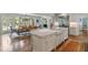 Open-concept kitchen boasts a marble island, stainless steel appliances, and seamless flow to the dining area at 675 W Paces Ferry Nw Rd # 11, Atlanta, GA 30327