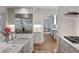 Bright kitchen with marble countertops, stainless steel refrigerator, and tile backsplash at 675 W Paces Ferry Nw Rd # 11, Atlanta, GA 30327