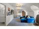 Attic living room with vaulted ceilings, built-ins, and a blue velvet sectional couch at 675 W Paces Ferry Nw Rd # 11, Atlanta, GA 30327