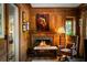Elegant living room features wood paneling, a cozy fireplace, and sophisticated decor at 675 W Paces Ferry Nw Rd # 11, Atlanta, GA 30327