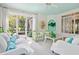Bright living area with glass doors, designer chairs, and a stylish ceiling fan at 675 W Paces Ferry Nw Rd # 11, Atlanta, GA 30327