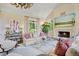 Inviting living room with a cozy fireplace, soft lighting, and comfortable seating at 675 W Paces Ferry Nw Rd # 11, Atlanta, GA 30327