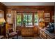 Home office featuring wood paneling, custom desk, and an elegant chair at 675 W Paces Ferry Nw Rd # 11, Atlanta, GA 30327
