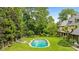 A serene backyard featuring a pool and spa, with lounge chairs and mature landscaping at 675 W Paces Ferry Nw Rd # 11, Atlanta, GA 30327