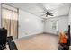 Spacious room with tile flooring and ample lighting, perfect for a home gym or recreation space at 7845 Chase Woods Dr, Jonesboro, GA 30236