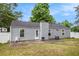 Exterior view of the home showcasing a patio and fenced yard for relaxing outdoor living at 7845 Chase Woods Dr, Jonesboro, GA 30236