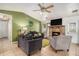 Inviting living area with stone fireplace, vaulted ceiling, and neutral color palette at 7845 Chase Woods Dr, Jonesboro, GA 30236
