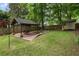 Large backyard featuring a gazebo and a fire pit area with ample space for outdoor activities and relaxation at 206 Flora Ne Ave, Atlanta, GA 30307